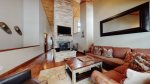 Bi-level 2 Bedroom  loft features a spacious living area and high vaulted ceilings and a wood-burning fireplace